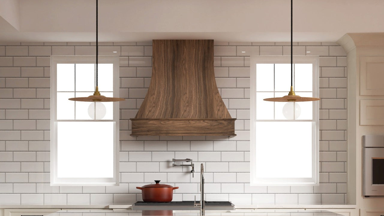 Fabuwood walnut artisan wood hood with white subway tile backsplash and pendant lights.