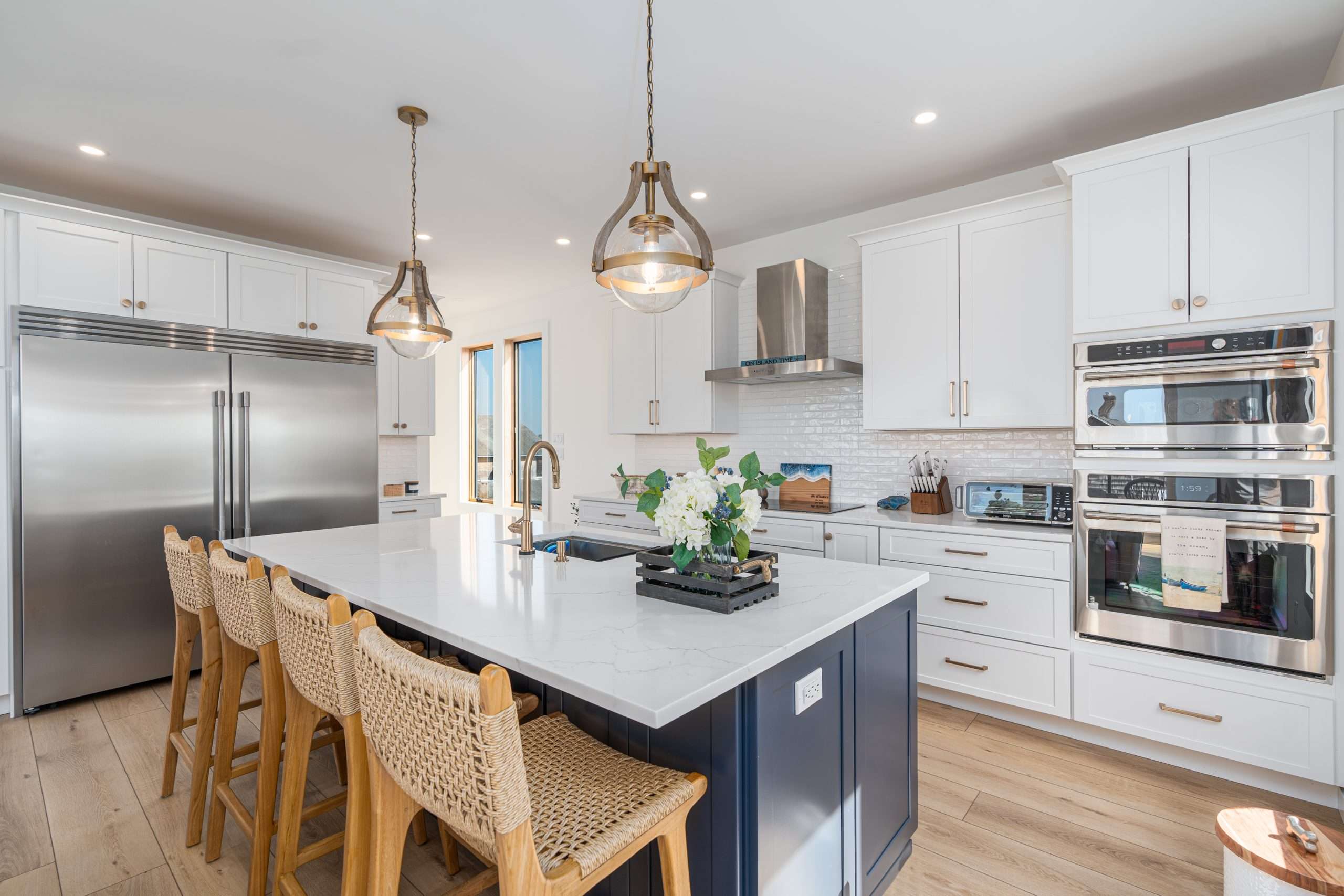 Blue and White Coastal Kitchen featuring Fabuwood Allure Galaxy Indigo island. 