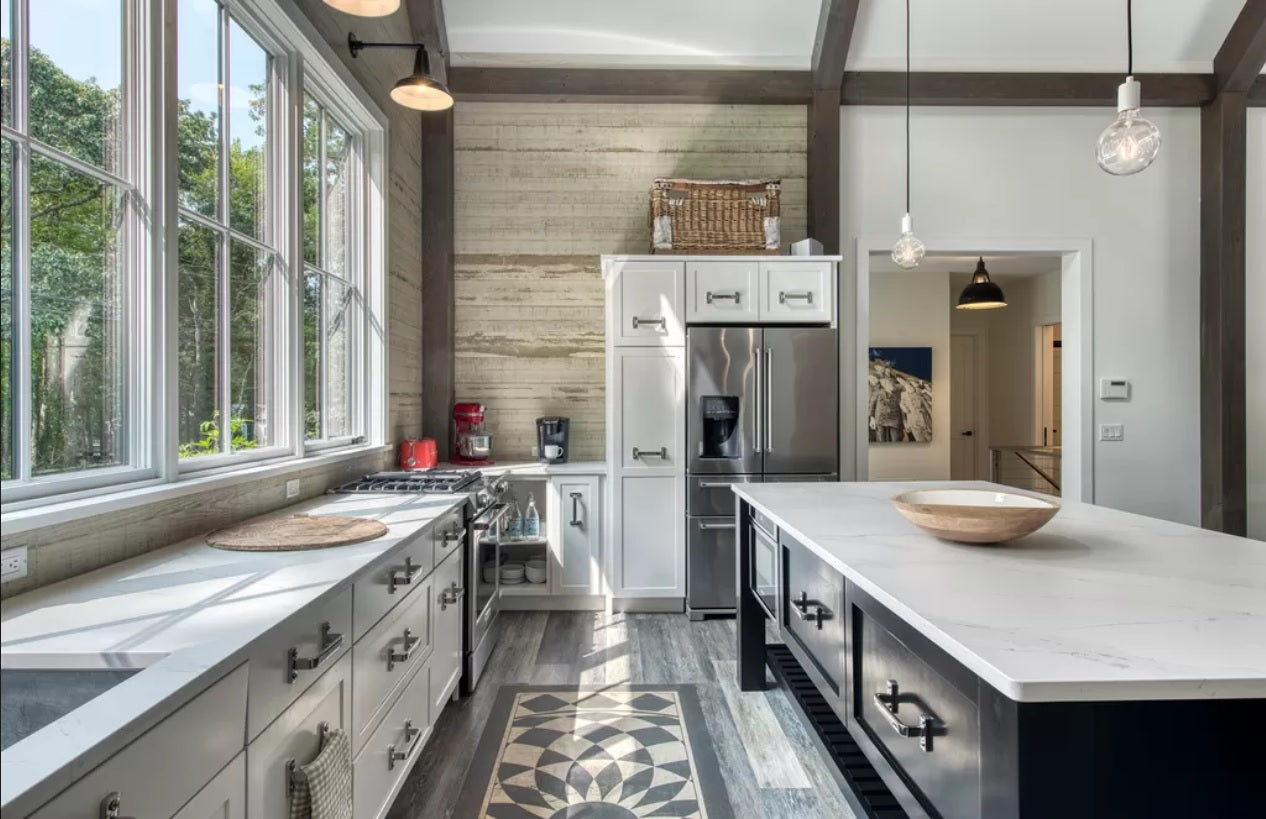 Industrial Kitchen with Dark Island and white countertops