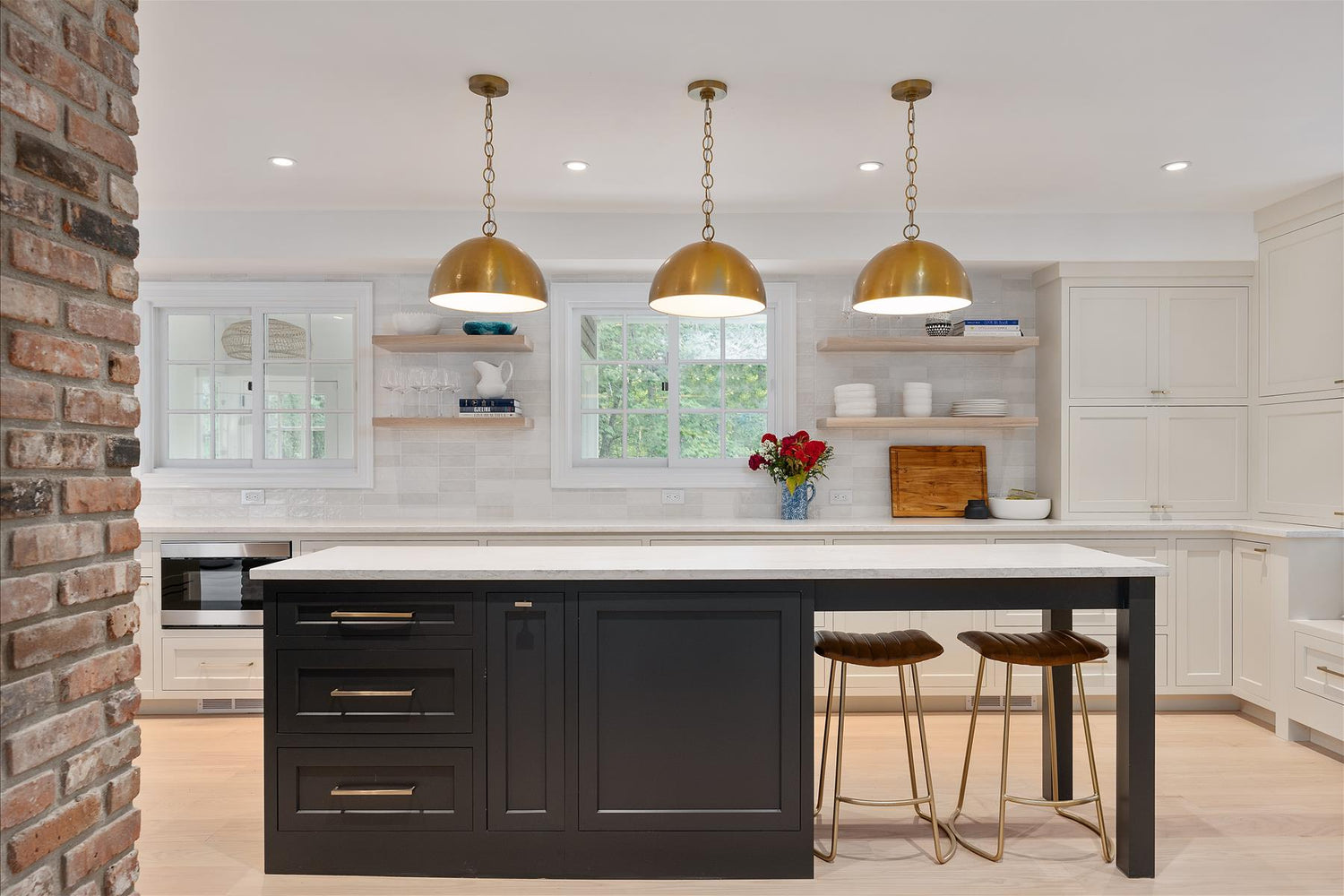 Kitchen Island with Seating. Gold Pendant Lights. Black Inset Cabinets. Shaker Style.