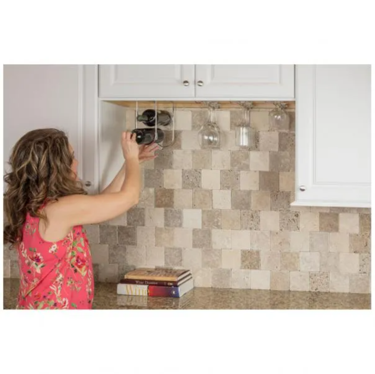 Polished Chrome Under Cabinet Wine Bottle Rack installed under cabinet with woman using it