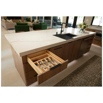 Kitchen island with cutlerty drawer open showing off the organizer
