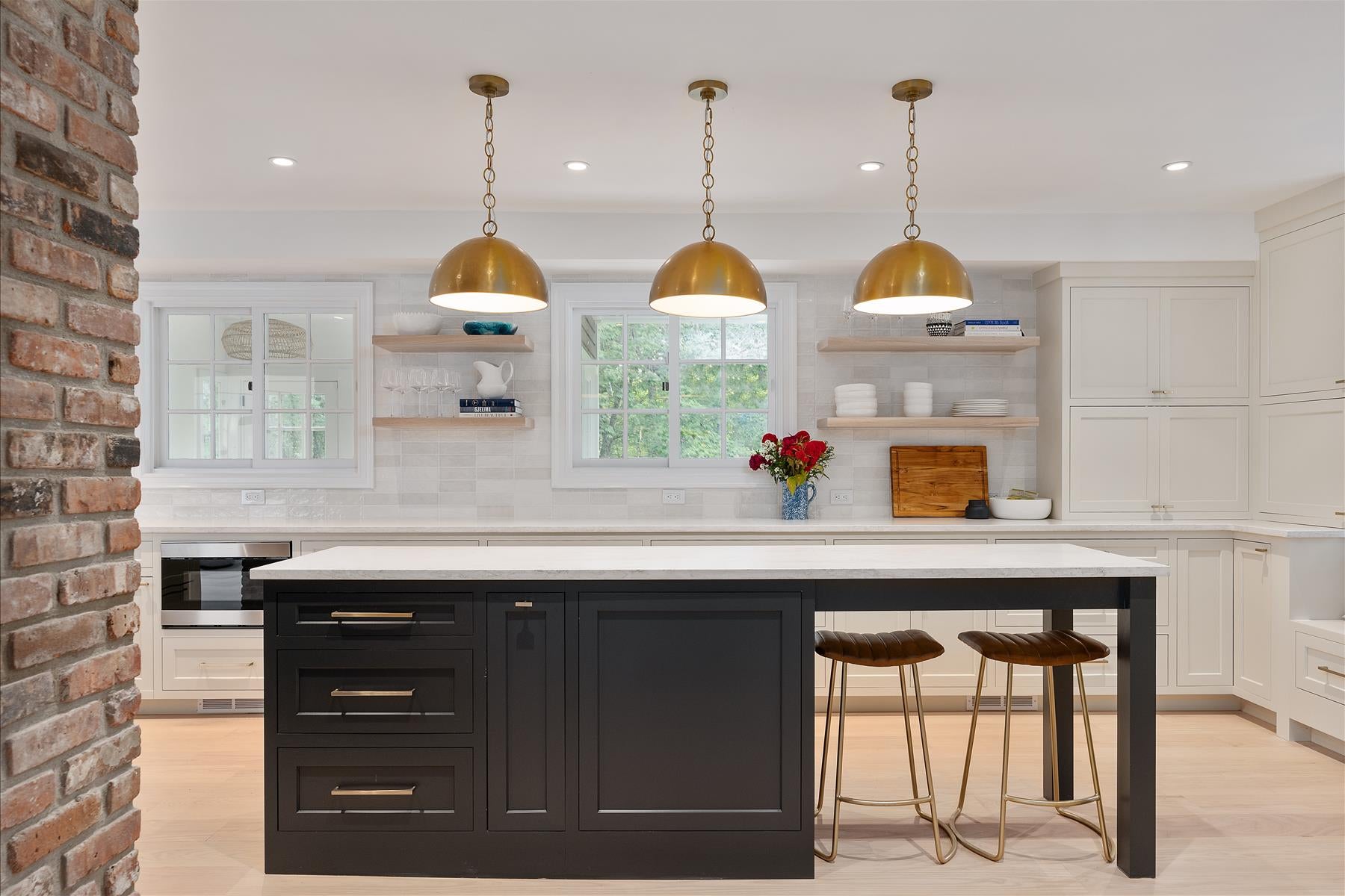 Kitchen Island with Seating. Gold Pendant Lights. Black Inset Cabinets. Shaker Style. 
